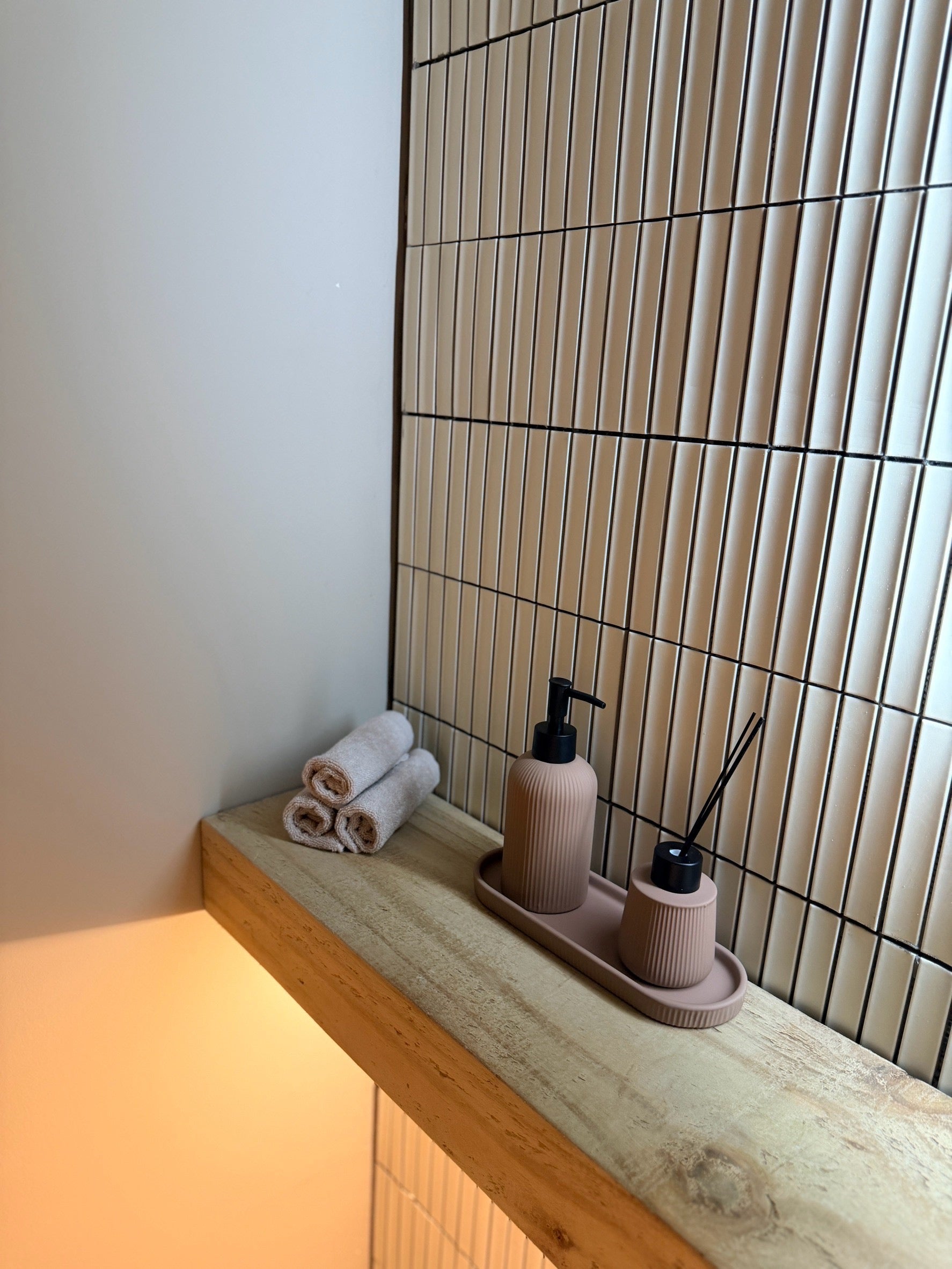 Treatment room details and fresh towels at Restore Rooms